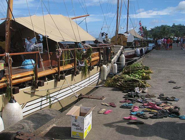 Flip flops are from the local children who were visiting the vaka