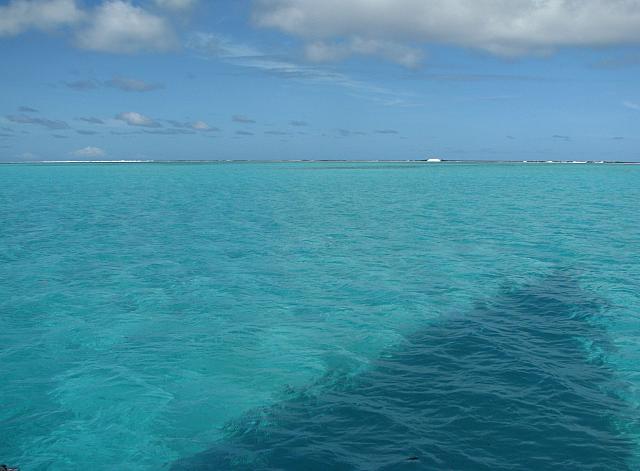Reef in the distance...shallow water in the foreground...shadow of our sail